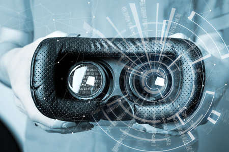 Virtual reality concept. Man or women holding in Hand VR glasses device with futuristic image in...