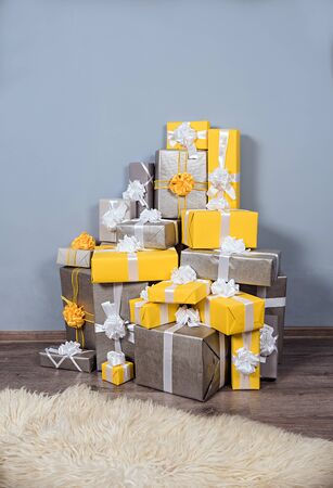 group of christmas yellow and grey gifts boxの写真素材