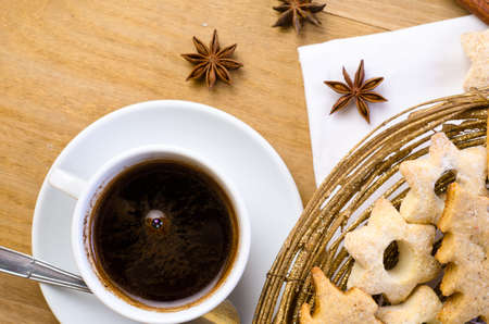 Cup of coffee with Christmas cookiesの写真素材