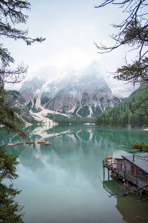 Braies lake and boats in mountain in Dolomitesの写真素材
