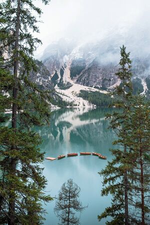 Braies lake and boats in mountain in Dolomitesの写真素材