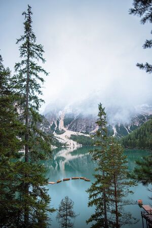 Braies lake and boats in mountain in Dolomitesの写真素材