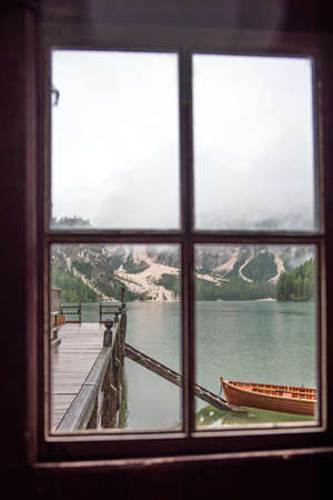 Braies lake and boats in mountain in Dolomitesの写真素材