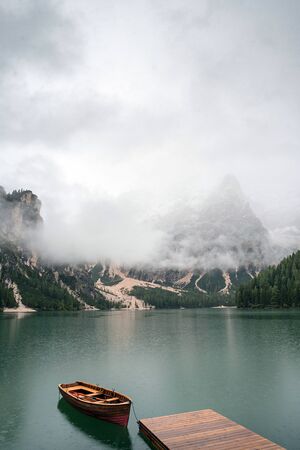 lake with boats mountainの写真素材