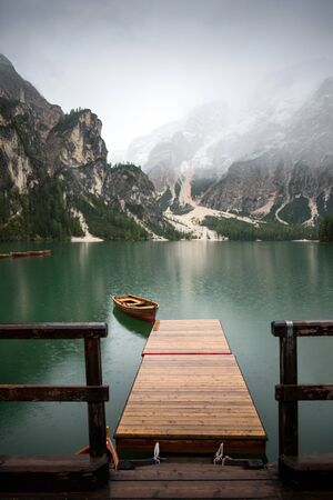 lake with boats mountainの写真素材