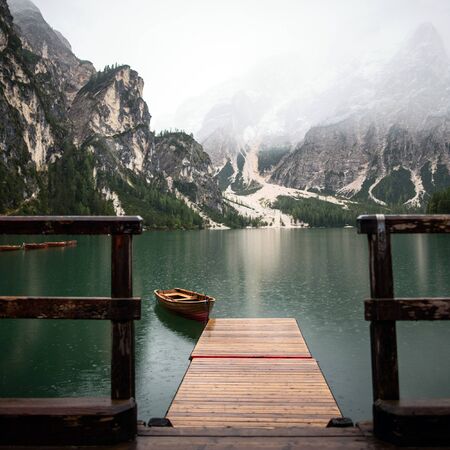 lake with boats mountainの写真素材