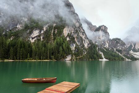 lake with boats mountainの写真素材