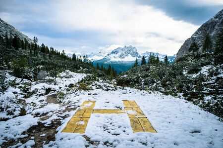 yellow helipad on the roof with mountain viewの写真素材