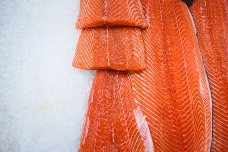 Fresh salmon fillet on ice