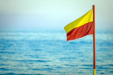red and yellow life saving flagの写真素材