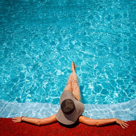 beautiful young woman in the swimming pool