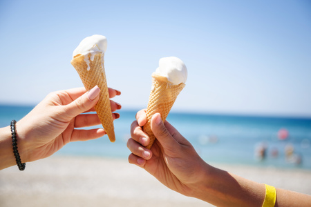 two hand with ice cream horns