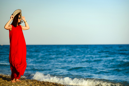 Beautiful sexy girl in a red dressの写真素材
