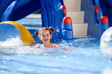 Girl Sliding in pool