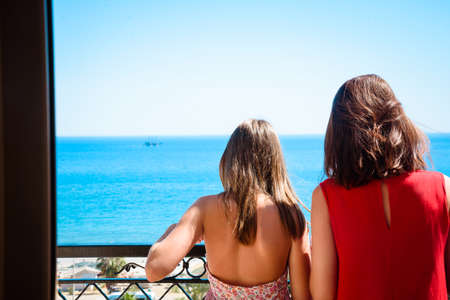 Mother and daughter on the seaの写真素材