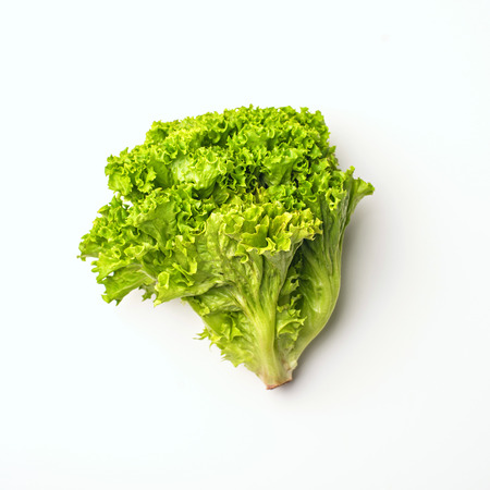 Green vegetables flat lay concept. lettuce salad on white background, top view with empty space for text.の写真素材