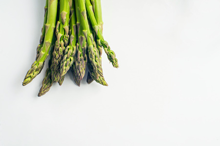 Food background asparagus flat lay pattern. fresh green asparagus on white background, top view.の写真素材