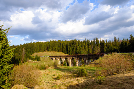mountain landscape. with old viaduct bridge in Vorohta, Ukraine. Carpathian Mountains.の写真素材
