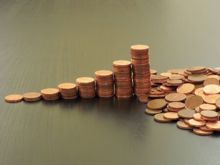 Coins on a table. Euros on a table, coins close-up. Savings in coins. Grow your savings. Stack of...