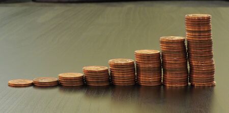 Coins on a table. Euros on a table, coins close-up. Savings in coins. Grow your savings. Stack of...