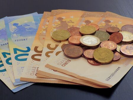 Euro money on a table, bills and coins. Earn Money working from home and grow your savings