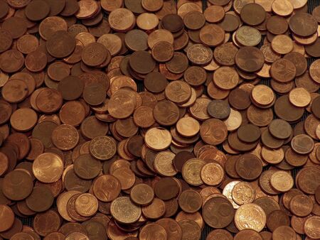 Coins on a table. Euros on a table, coins close-up. Savings in coins. Grow your savings. Stack of Coins. Growing Money.の写真素材