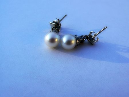 White gold earrings with pearlの写真素材