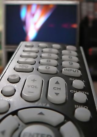 Remote control for home electronic devices with TV set in the background