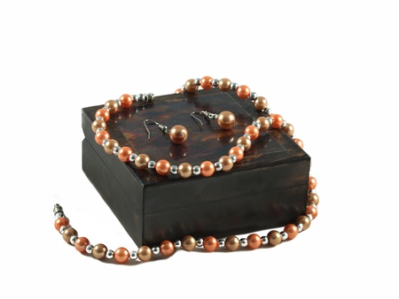 Set of pearl jewelry on a wooden boxの写真素材