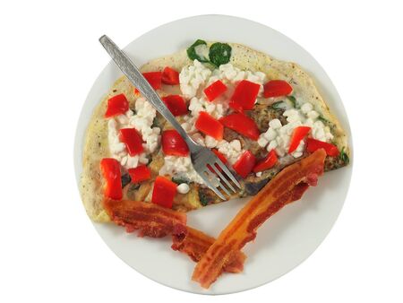Breakfast plate with omelette, bacon, spinach, bell pepper and cottage cheeseの写真素材