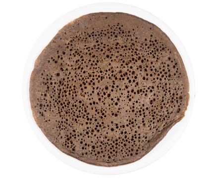 Traditional Ethiopean flatbread from fermented teff flour on a white plateの写真素材