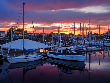 Yachts moored at the marina at the sunset
