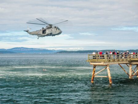 Helocopter crew performing water rescue trainingのeditorial素材