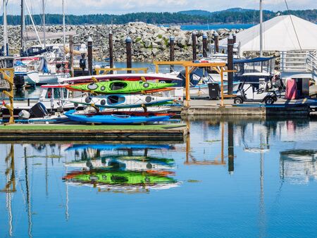 Stack of canoe for rent at the boat marinaの写真素材