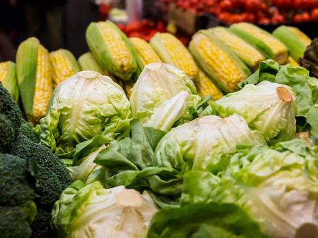 Variety of fresh vegetables displayed on the farmers marketの写真素材