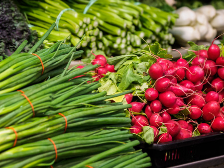 Variety of fresh vegetables displayed on the farmers marketの写真素材
