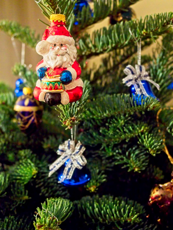 Christmas tree decorated with glitter, lights and glass balls for the Christmas and New Year celebrationsの写真素材