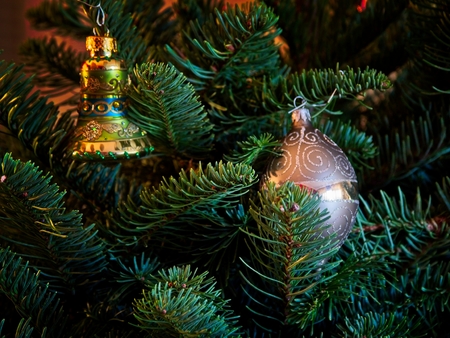 Christmas tree decorated with glitter, lights and glass balls for the Christmas and New Year celebrationsの写真素材