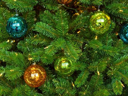 Christmas tree decorated with glitter, lights and glass balls for the Christmas and New Year...