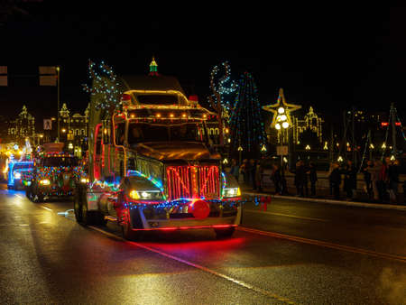 VICTORIA BC, CANADA - DECEMBER 2, 2017: Truck Light Parade, annual celebration of Christmas organized by Island Equipment Owners Association. Trucks decorated with Christmas lights parade downtownのeditorial素材