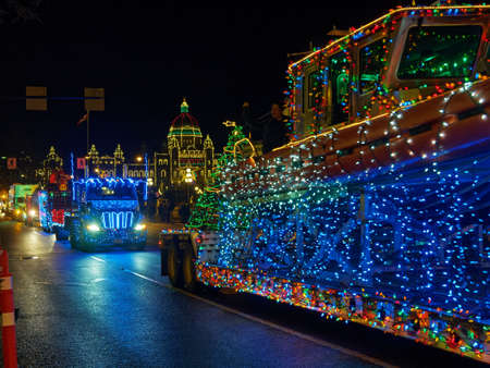 VICTORIA BC, CANADA - DECEMBER 2, 2017: Truck Light Parade, annual celebration of Christmas organized by Island Equipment Owners Association. Trucks decorated with Christmas lights parade downtownのeditorial素材
