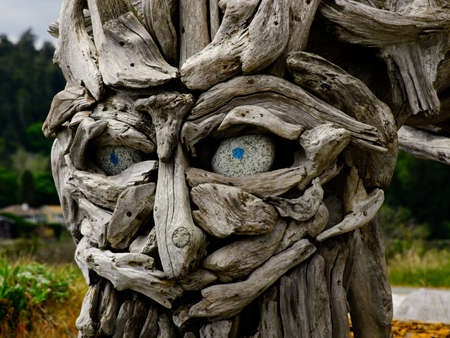 Victoria BC, Canada - May 12, 2021. Driftwood sculptures along the beach of Esquimalt lagoonのeditorial素材