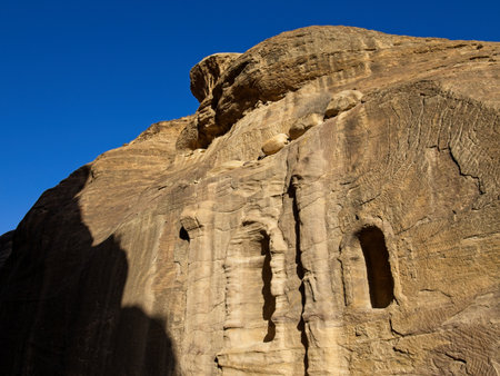 The Siq, scenic canyon serving as an entrance to ancient city Petra, Jordan, one of seven Wonders of the Worldの写真素材