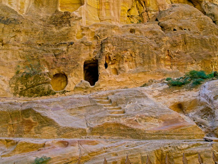 The Siq, scenic canyon serving as an entrance to ancient city Petra, Jordan, one of seven Wonders of the Worldの写真素材