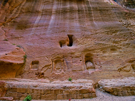 The Siq, scenic canyon serving as an entrance to ancient city Petra, Jordan, one of seven Wonders of the Worldの写真素材
