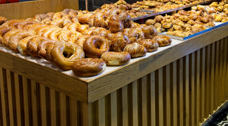 Showcase displaying various baked goods in the store windowの写真素材