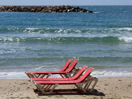 Chairs and lounges at the spectacular sandy beach of Netanya, Israel. Mediterranean coast on a sunny dayの写真素材