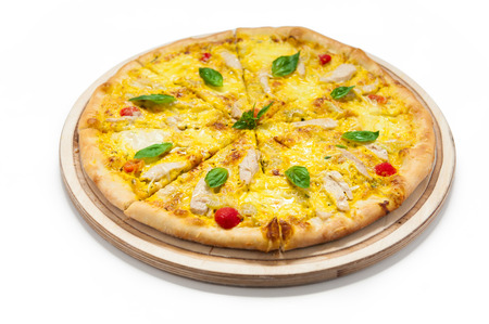 Pizza with eggs and cheese on a wooden boardの写真素材