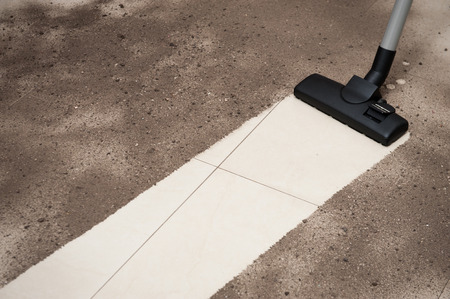 Vacuum cleaning tiled floorの写真素材
