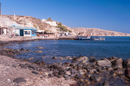 Typical greek taverns on one of the beaches of Akrotiri on the southern peninsula of Santorini island, Greece.の写真素材
